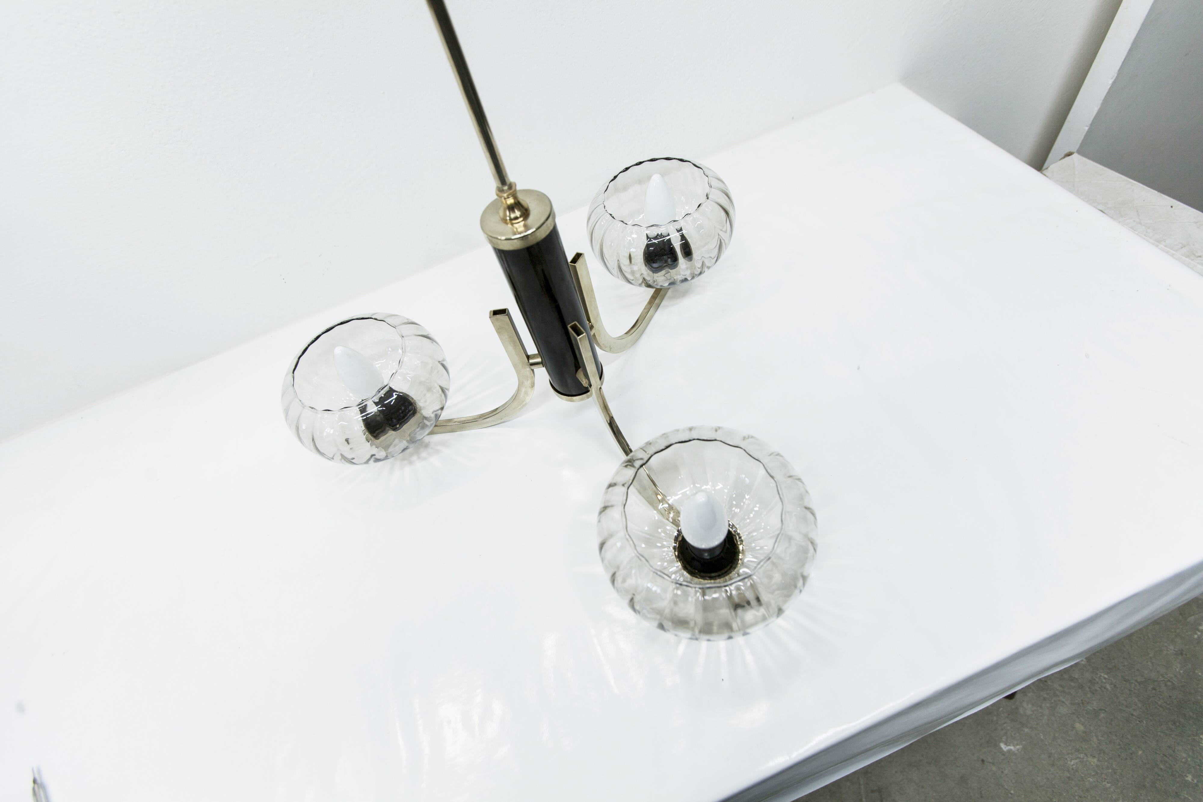 See Delmas chandelier, 3 arms, black and gold, clear glass, 1960