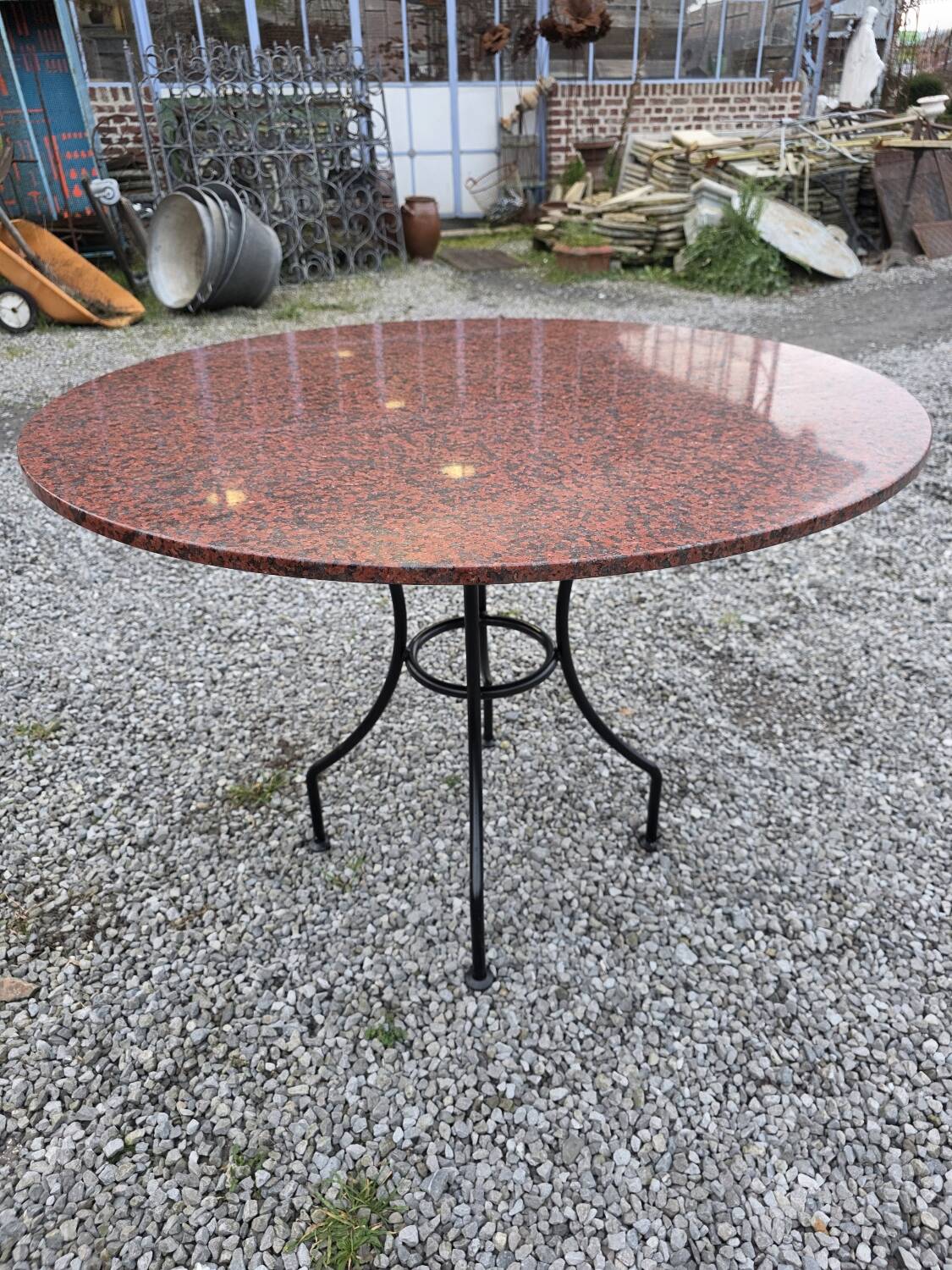 Round marble table with wrought iron base from the mid-20th century.