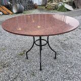 Round marble table with wrought iron base from the mid-20th century.