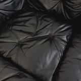 Vintage corner sofa composed of 3 modules in black leather with integrated bed.