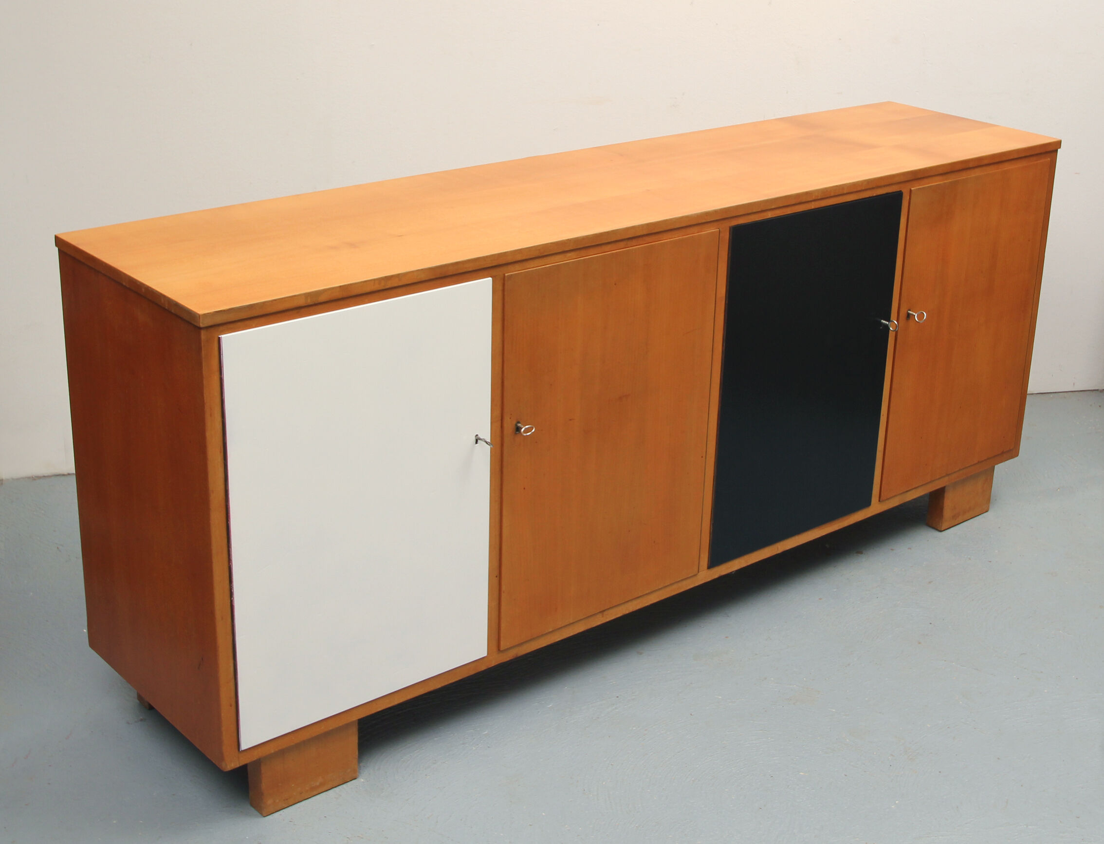 Sideboard in cherrywood with black and white doors 1950s