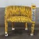 Wooden armchair with a "tiger" appearance.
