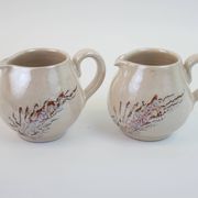 Pair of ceramic milk jugs signed La Roue Vallauris