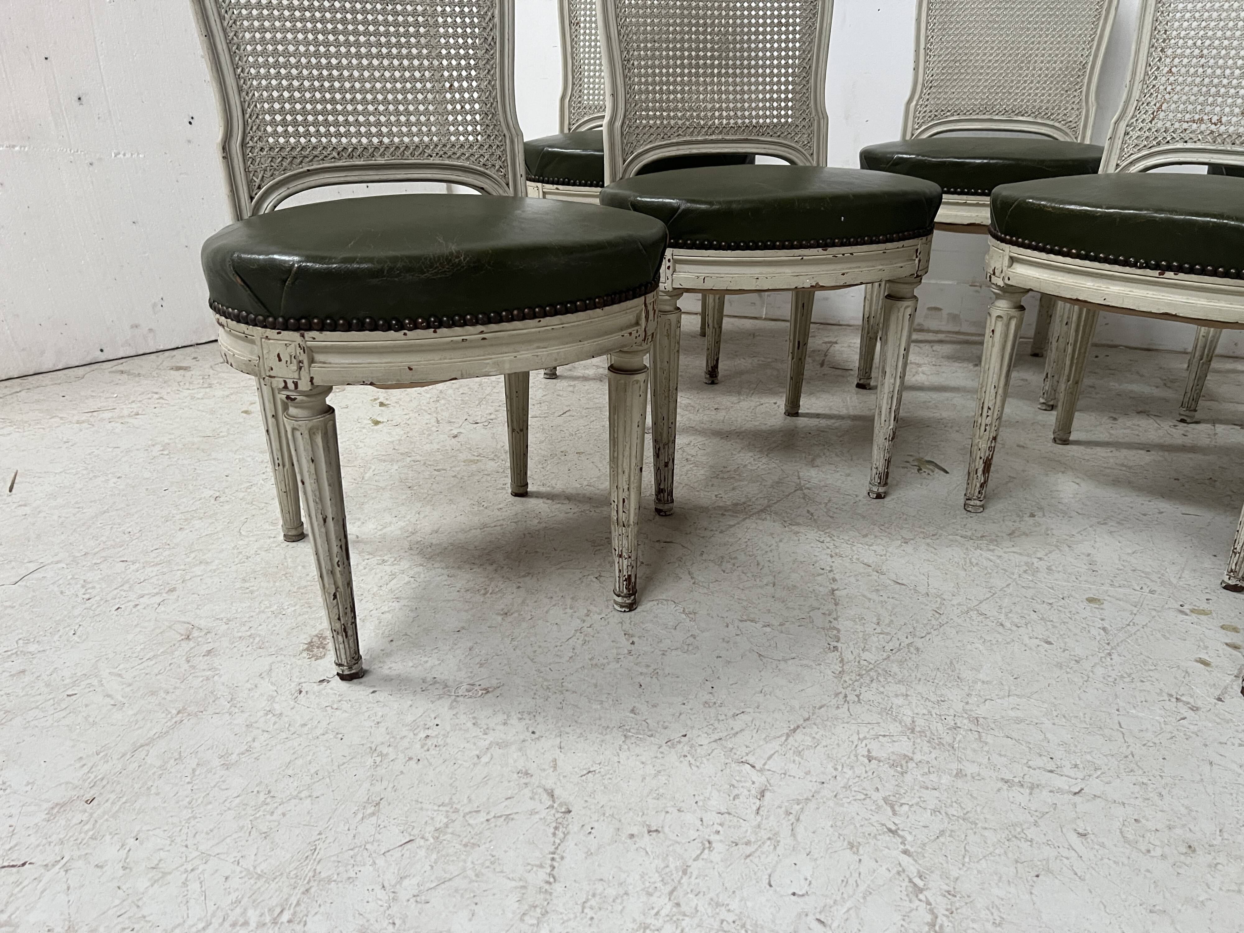 Set of seven Louis XVI style chairs in patinated beech, 20th century.