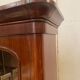 English showcase in two mahogany bodies and 19th century veneer