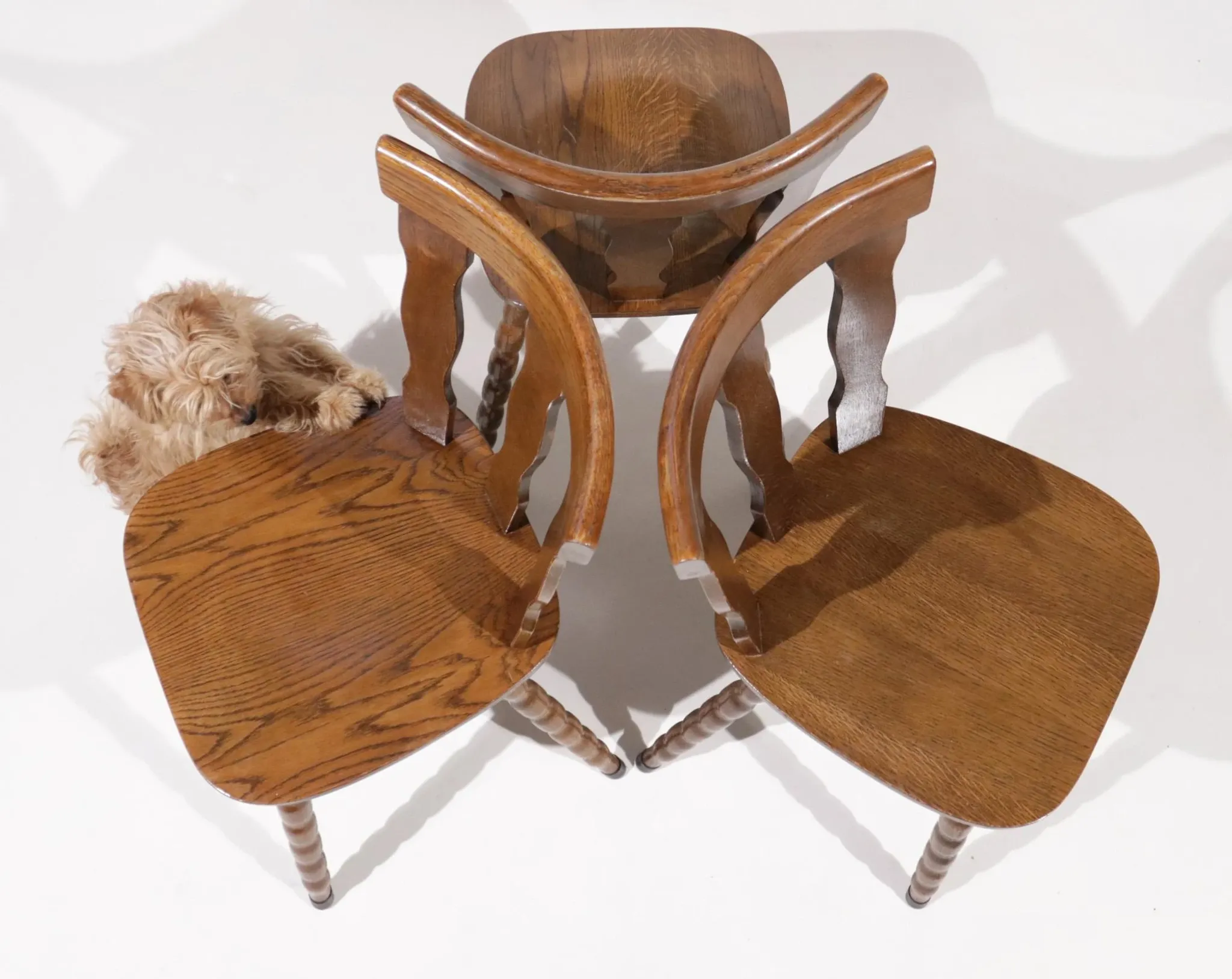 Set of 3 brutalist chairs with arched cut-outs and turned legs