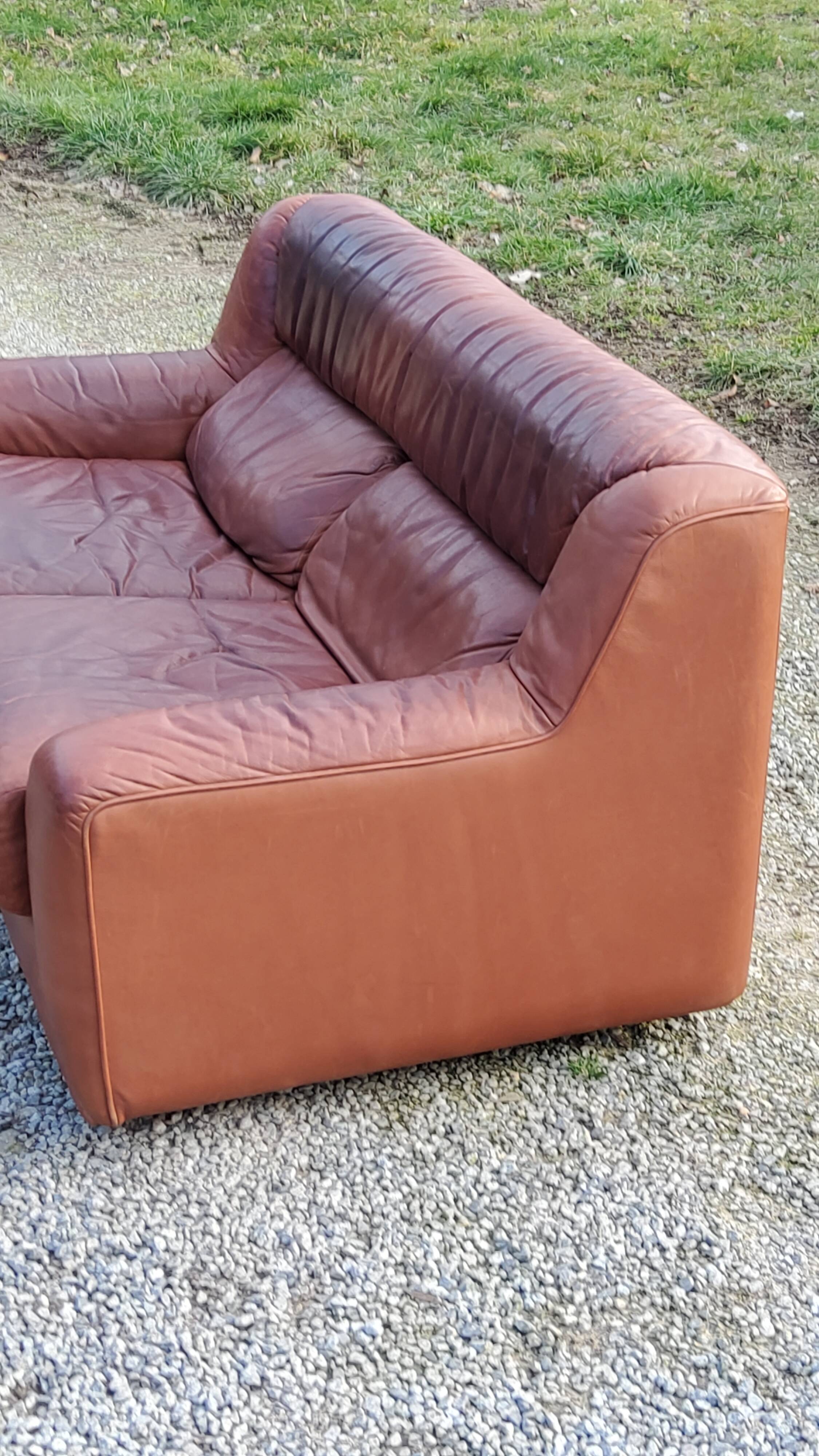 Pair of armchairs and De Sede sofa in cognac leather from the 70s/80s