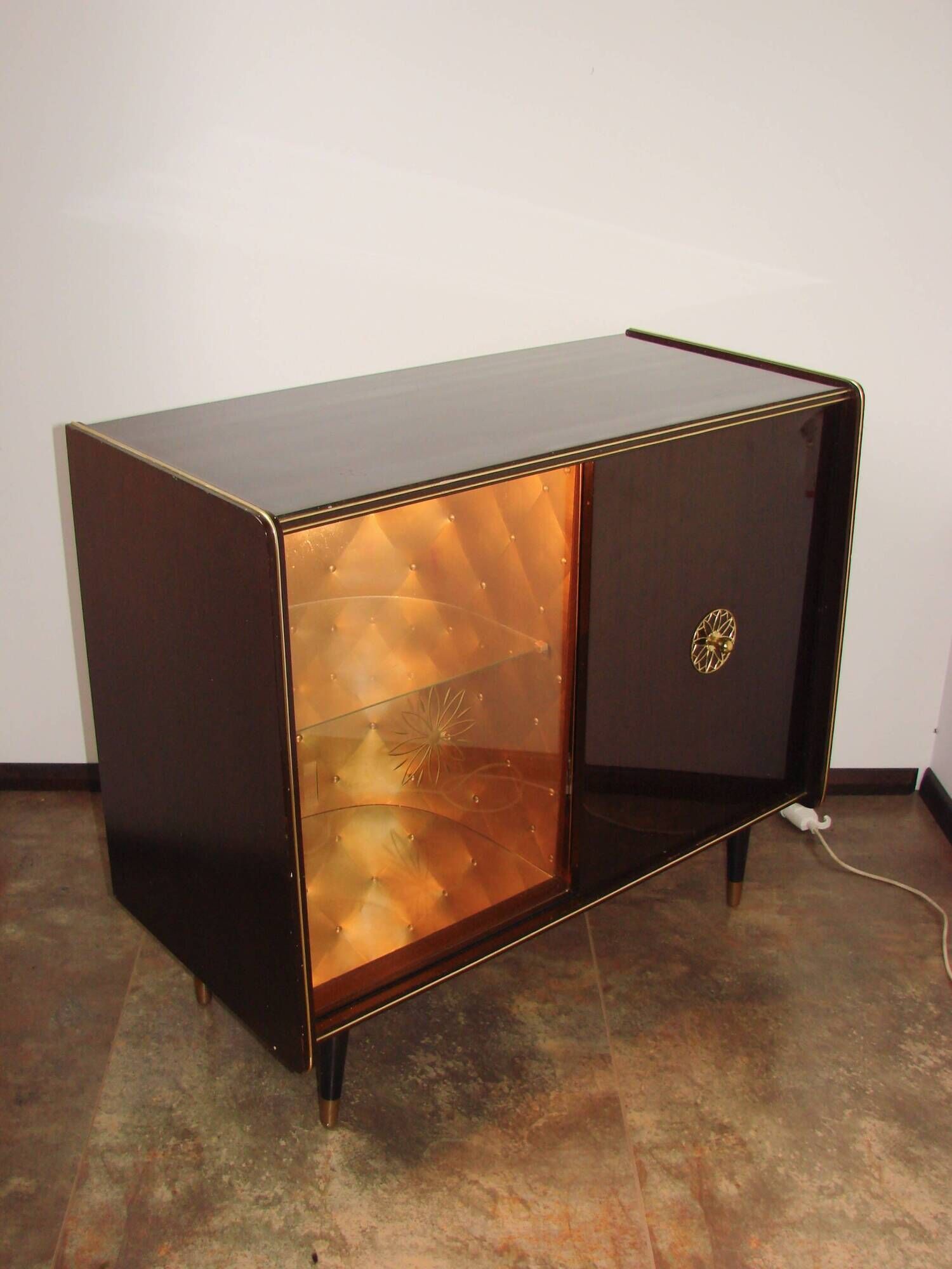 A vintage cabinet with a record player and a bar, 1960s.