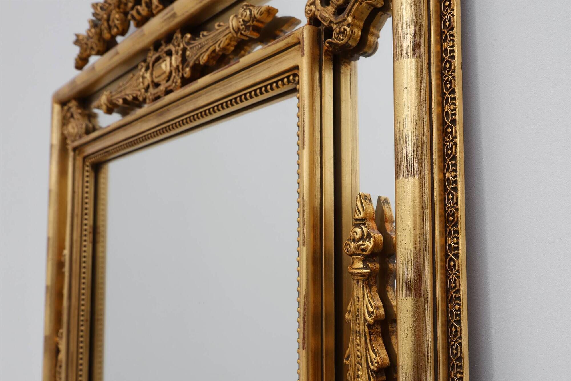 Louis XVI style gilt mirror with laurel wreath crest, Belgium, 20th century