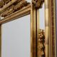 Louis XVI style gilt mirror with laurel wreath crest, Belgium, 20th century