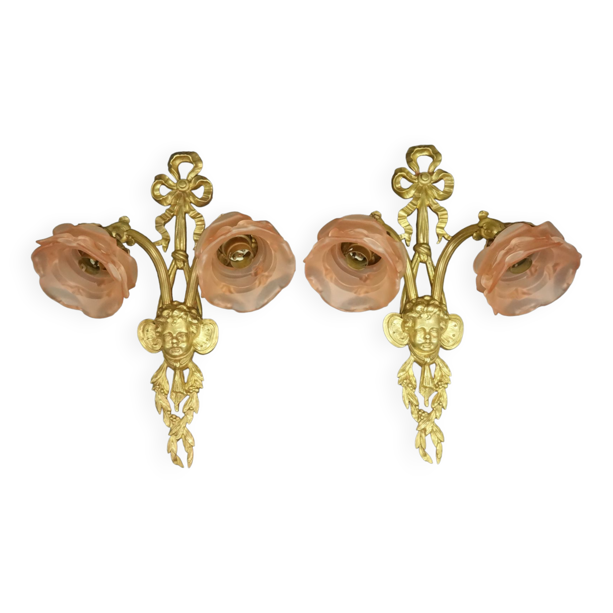 Pair of sconces with the heads of Zephyr Louis XVI style