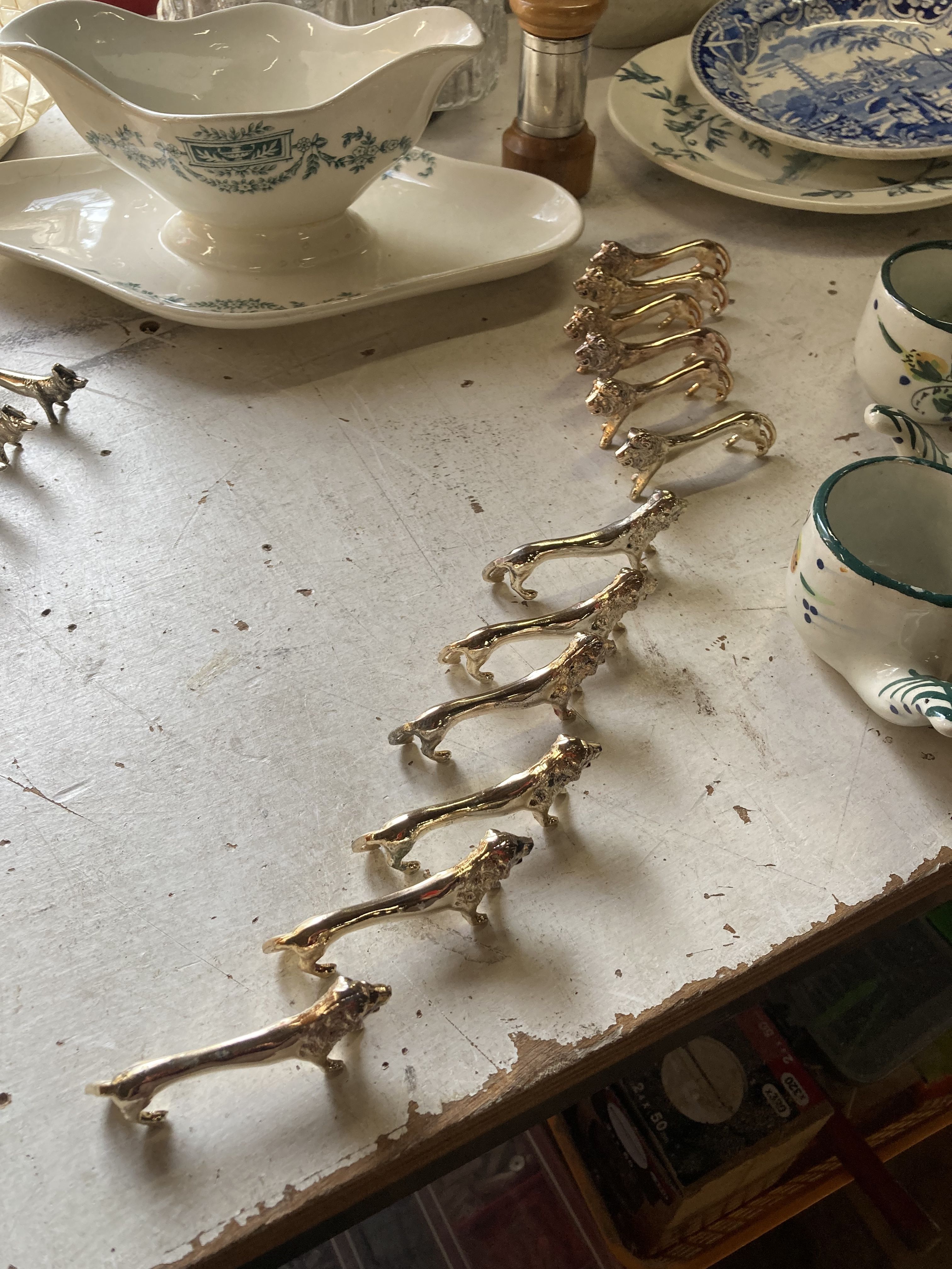 12 vintage gilded gold metal lion animal knife holders