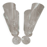 4 Flûtes à champagne  en cristal avec pieds ornementés de deux noeuds.