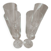4 Flûtes à champagne  en cristal avec pieds ornementés de deux noeuds.