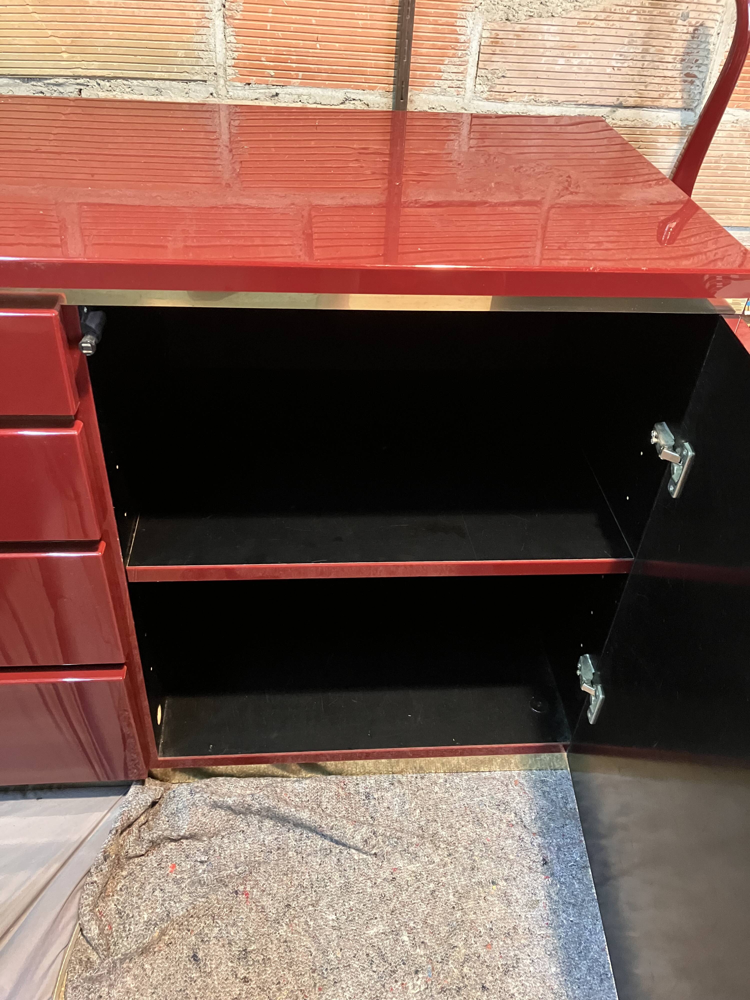 Burgundy lacquered vintage enfilade and brass by Eric Maville