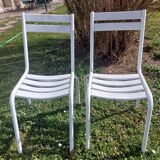 pair of white metal chairs, Tolix style