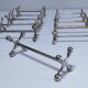 Eleven 70s design metal "crosshair" knife holders