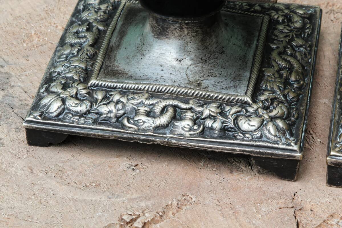 Pair of square candlesticks in patinated bronze