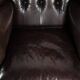 Dark brown cowhide Chesterfield wingback armchair in classic English style