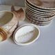 Many flat plates, dish, sauce boat, vegetable dish.