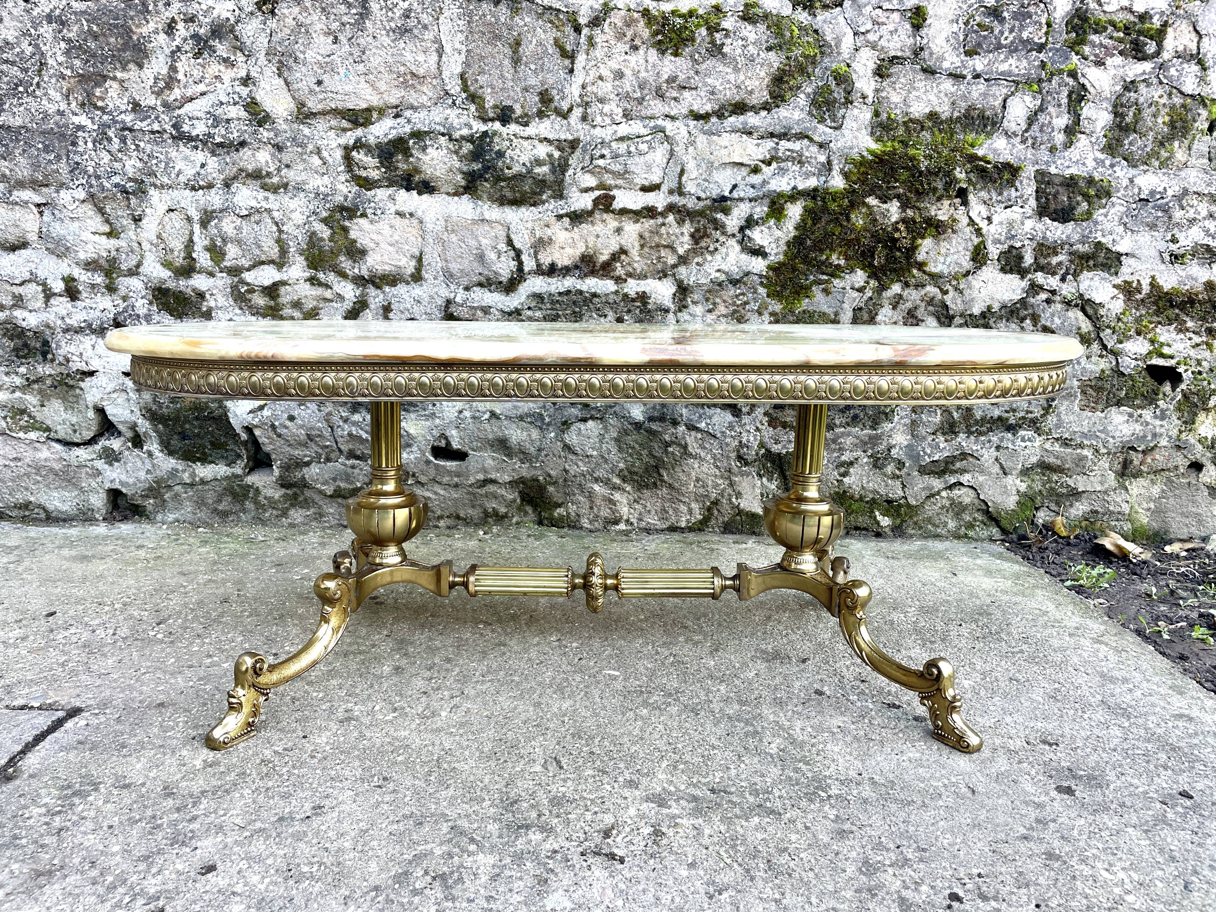 Louis XVI style oval coffee table in onyx and gilt brass