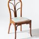 Pair of rattan and blue floral fabric chairs