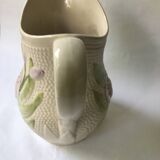 Barbotine pitcher with embossed tulip decoration and spike