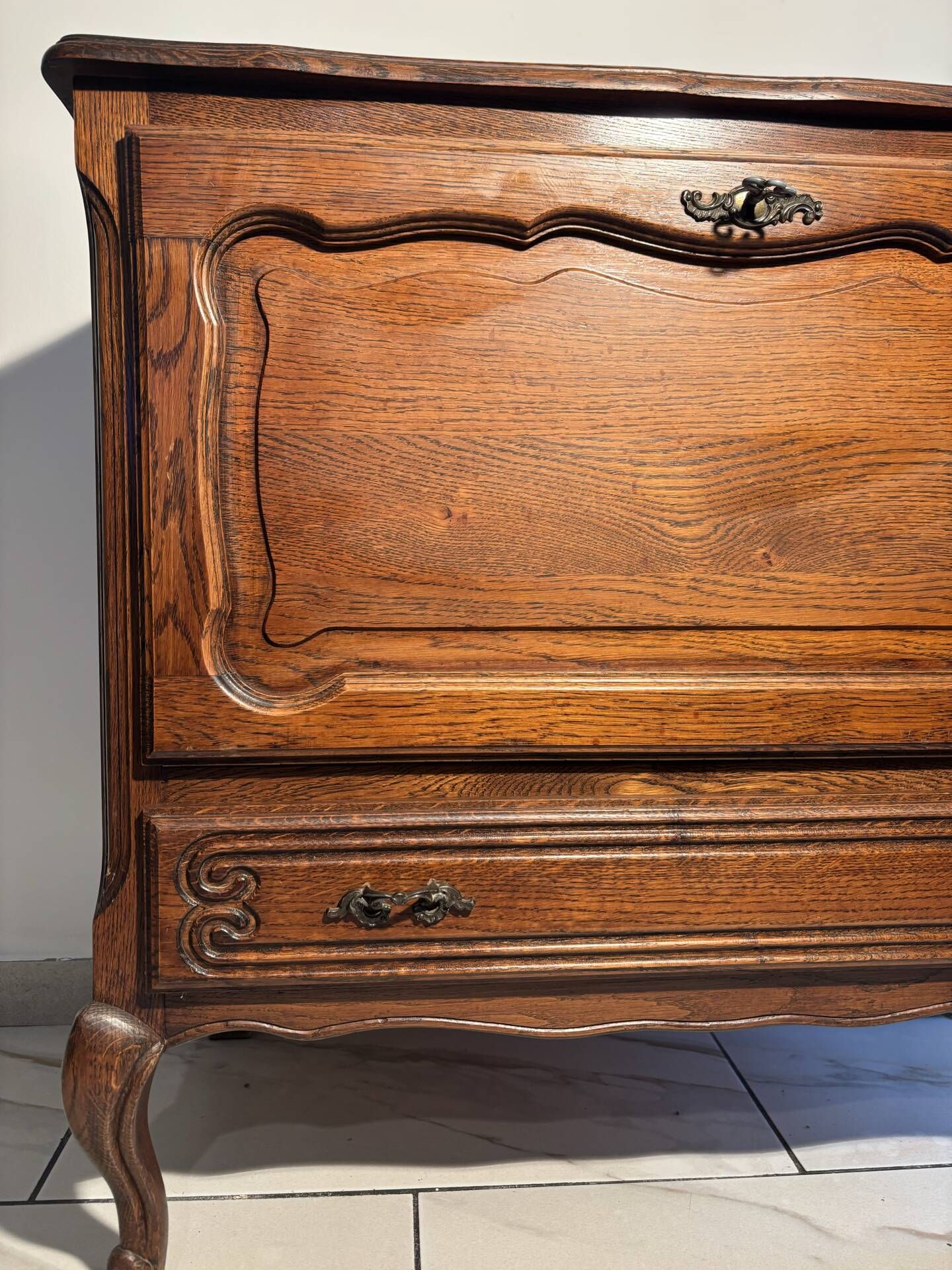 Louis XV style oak TV cabinet with drop-down flap.