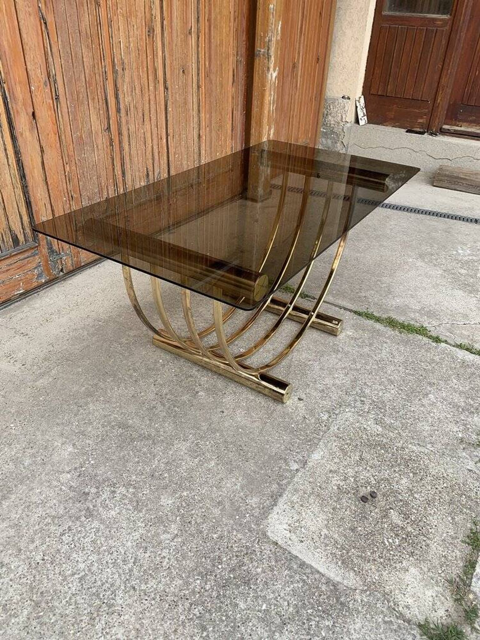 Dining table in brass and straw yellow glass, Regency style, 1970s.