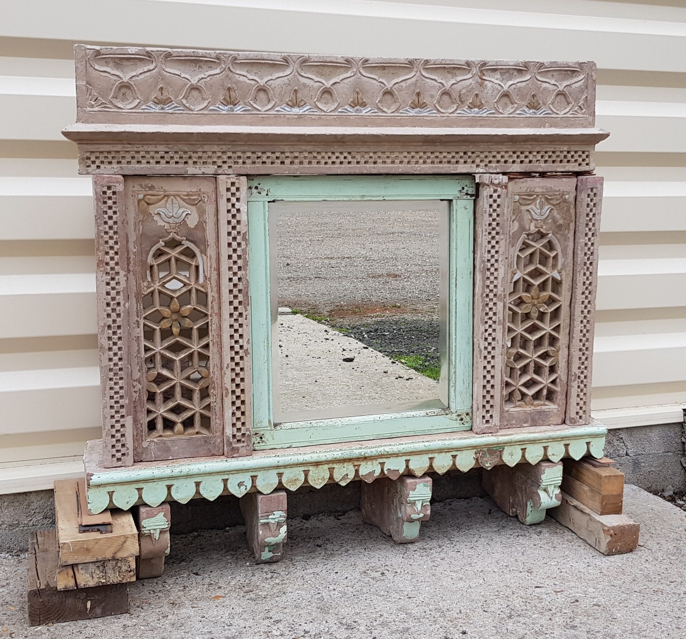 Fully hand-carved stone window with mirror