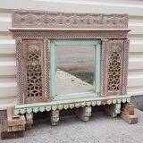 Fully hand-carved stone window with mirror