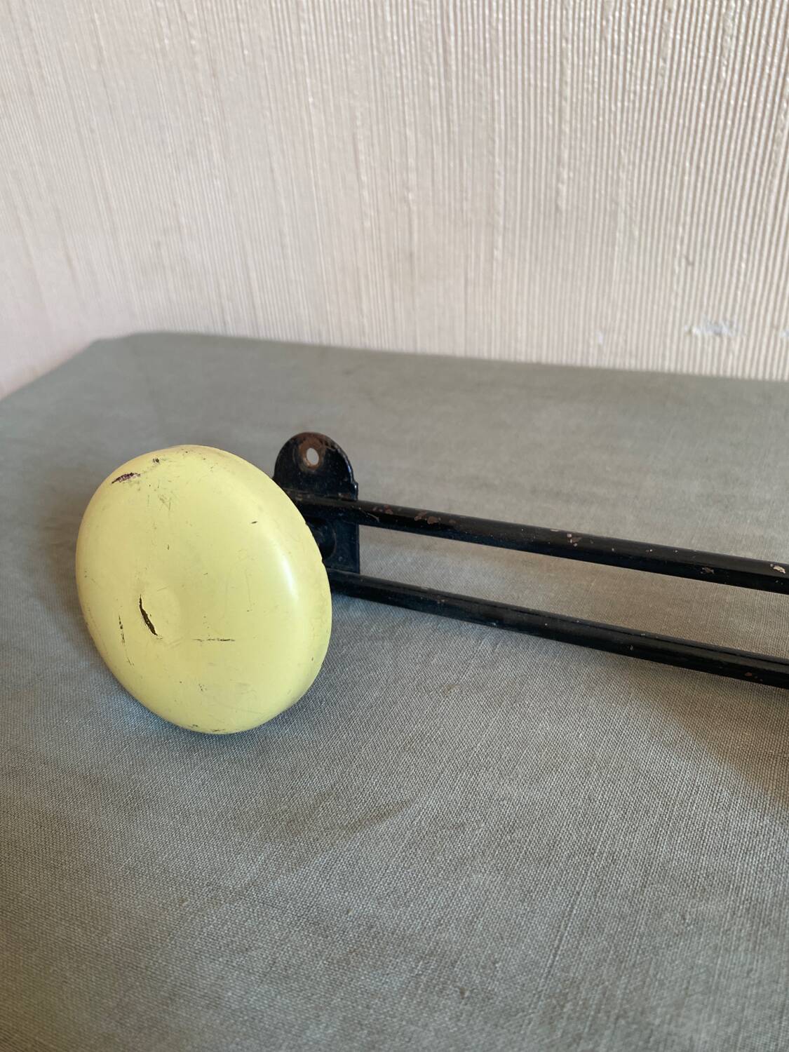 2 black and yellow metal wall coat racks