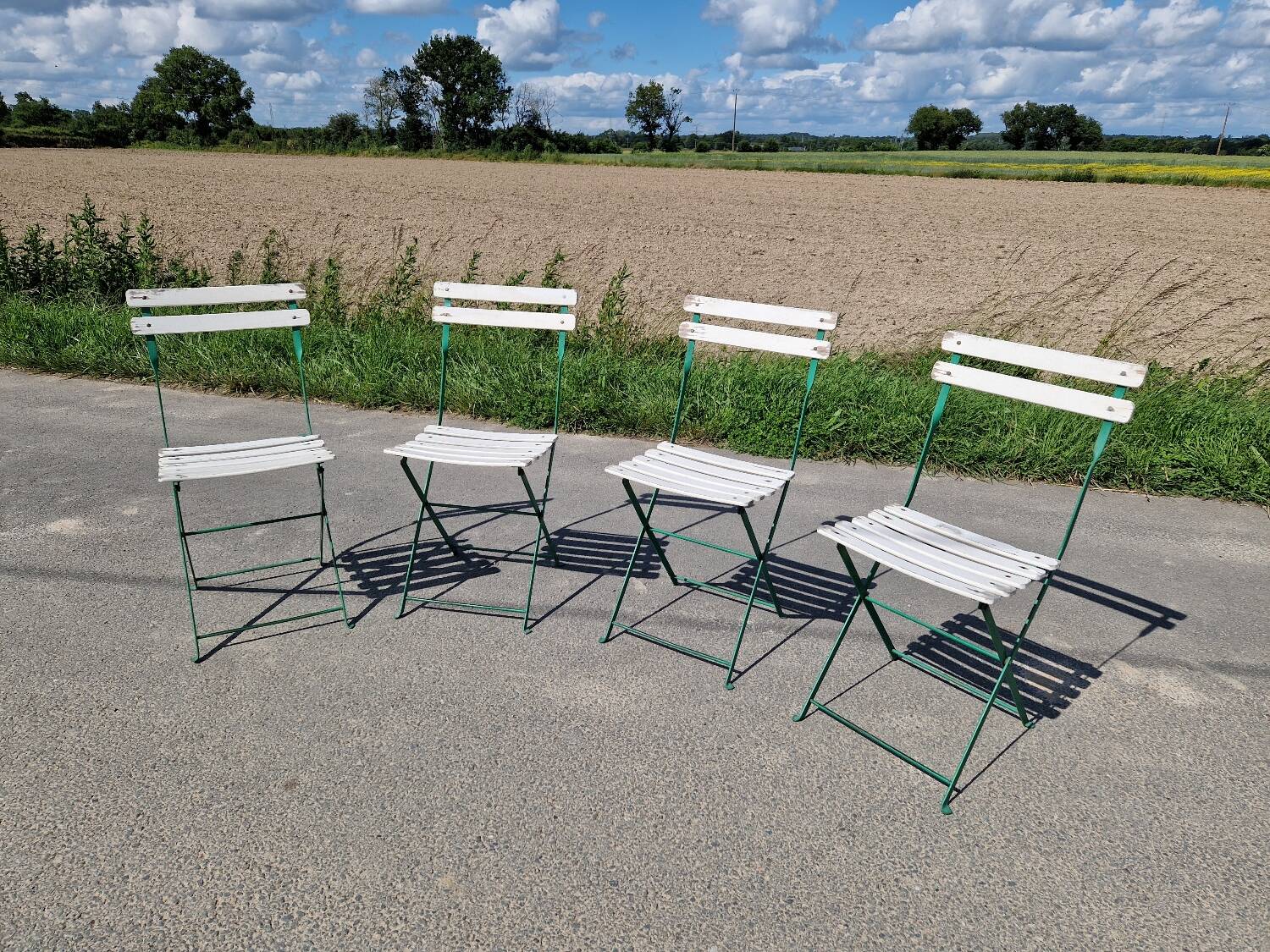 Set of 4 folding wrought iron bistro chairs