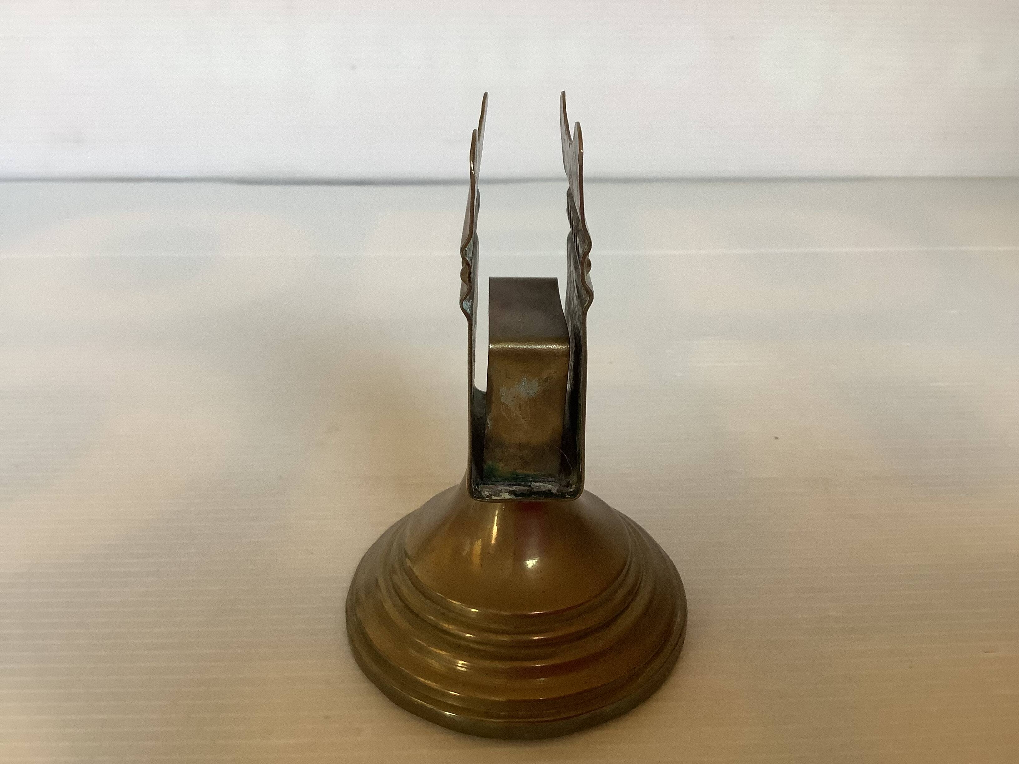 Antique brass match holder with tulip base.