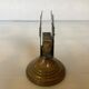 Antique brass match holder with tulip base.