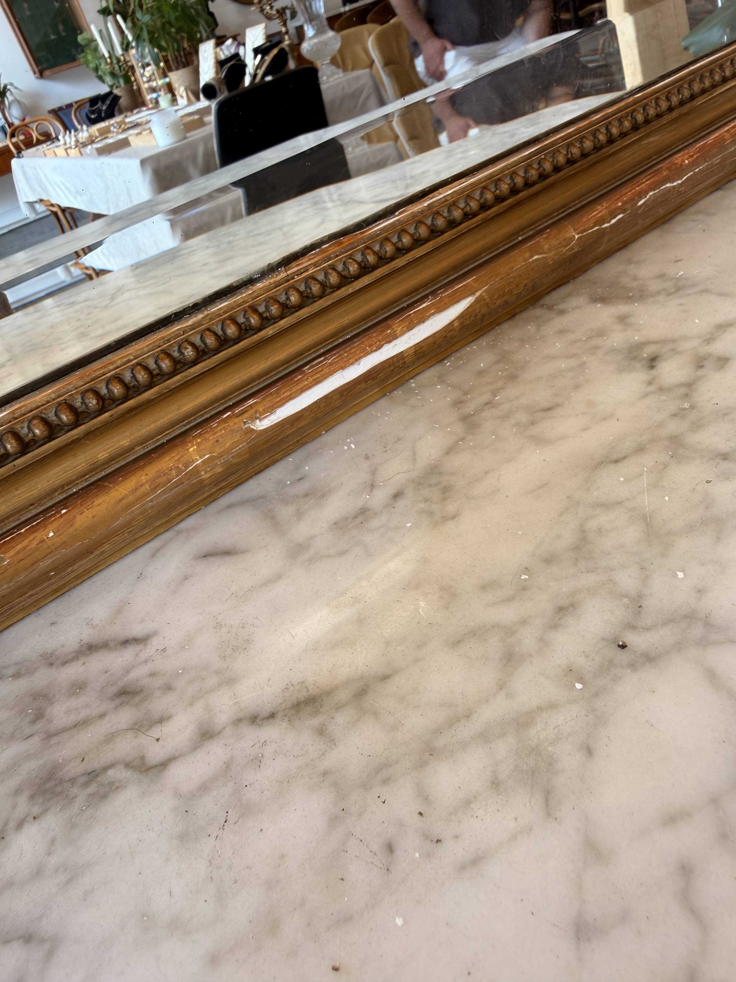 Large antique Louis XV style mirror in gilded wood.