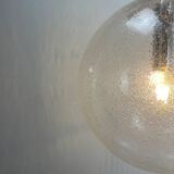 Large suspended lamp with a glass globe featuring bubbles by Peill & Putzler 1970.