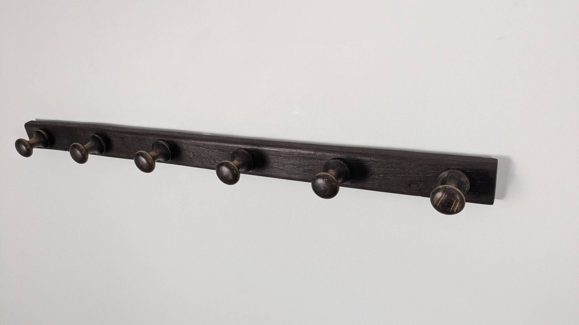Antique turned wooden coat rack with 6 hooks, rustic spirit.