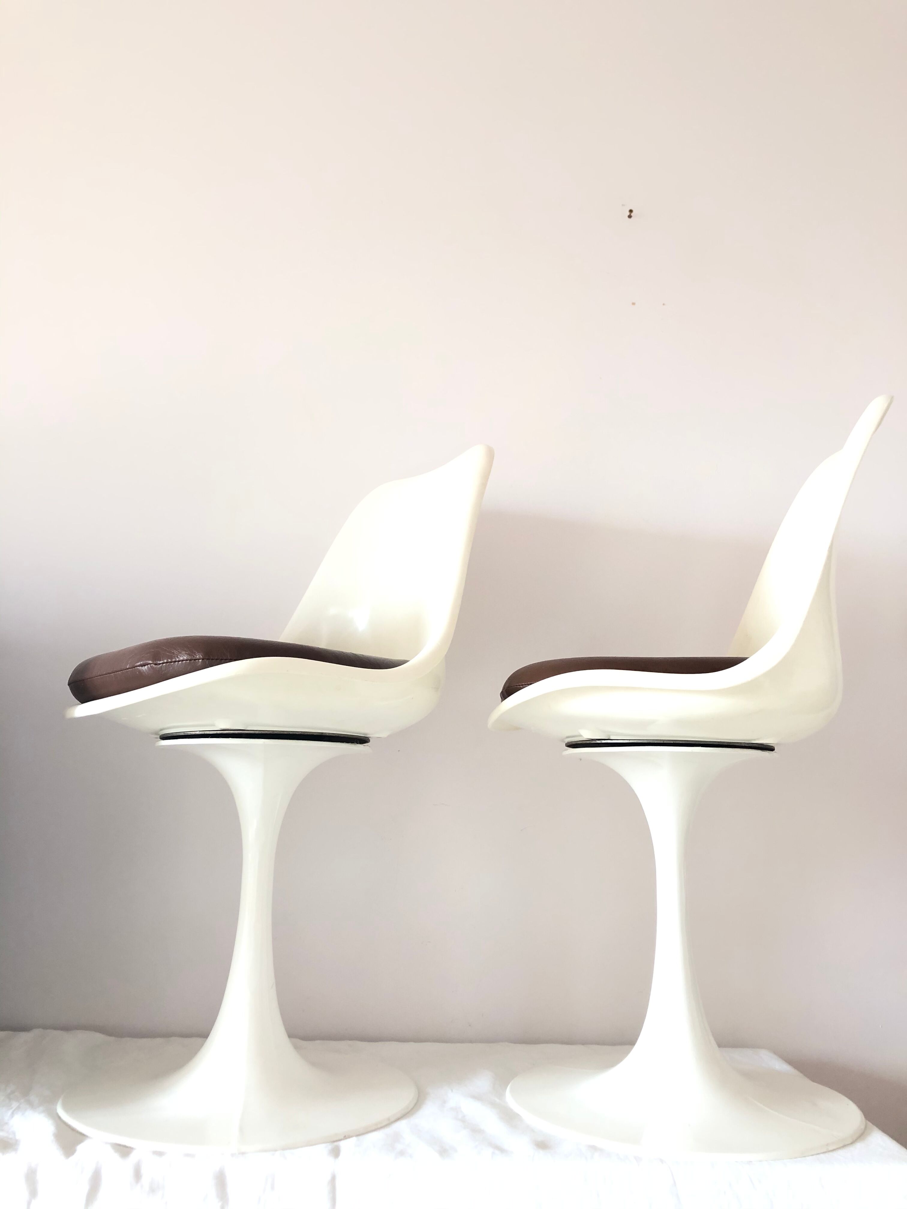 Pair of vintage tulip foot swivel chairs