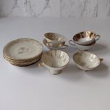 Set of mismatched fine porcelain cups signed with saucer