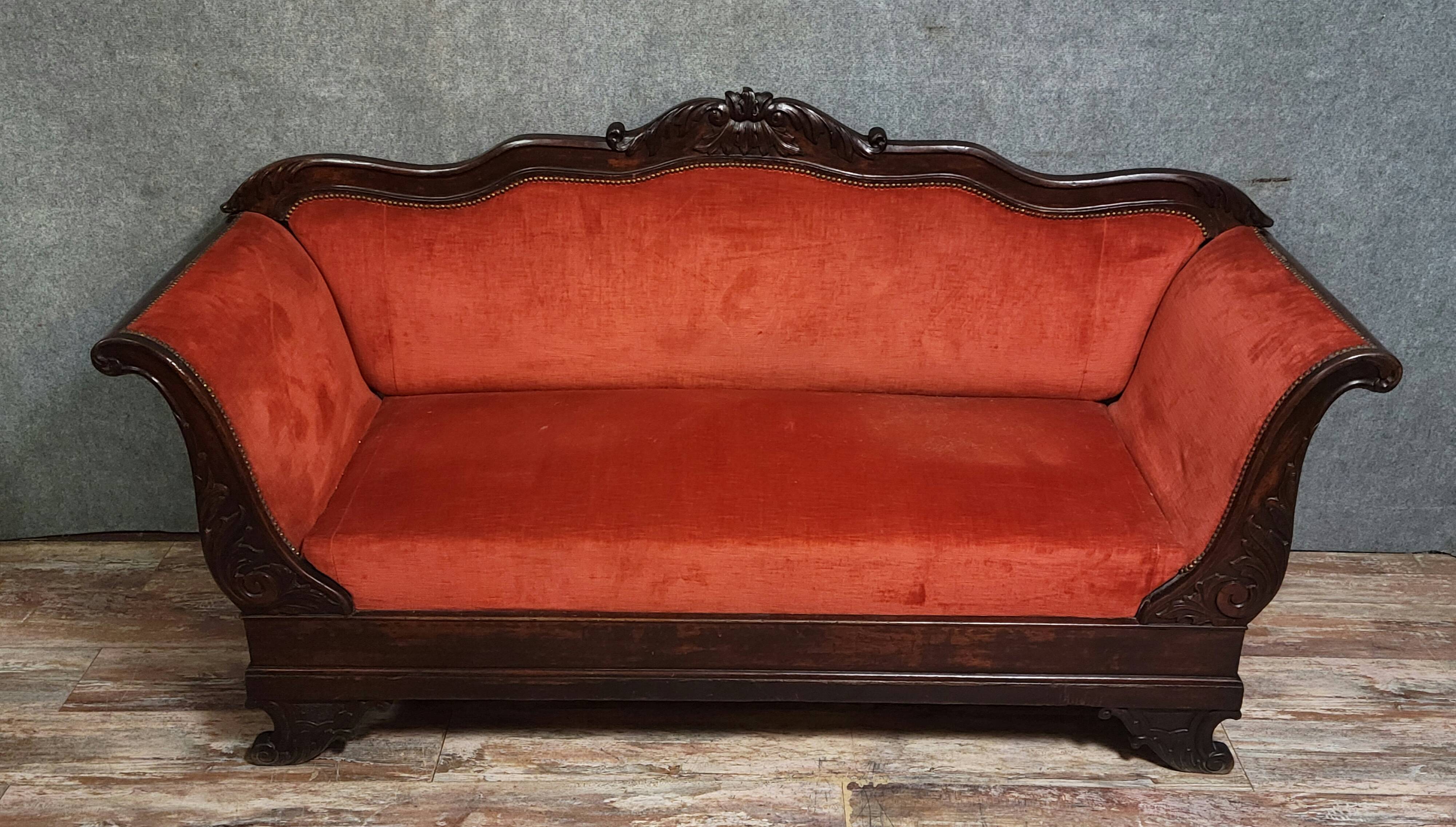 Sleeper or bench from the Charles X period in richly carved mahogany.