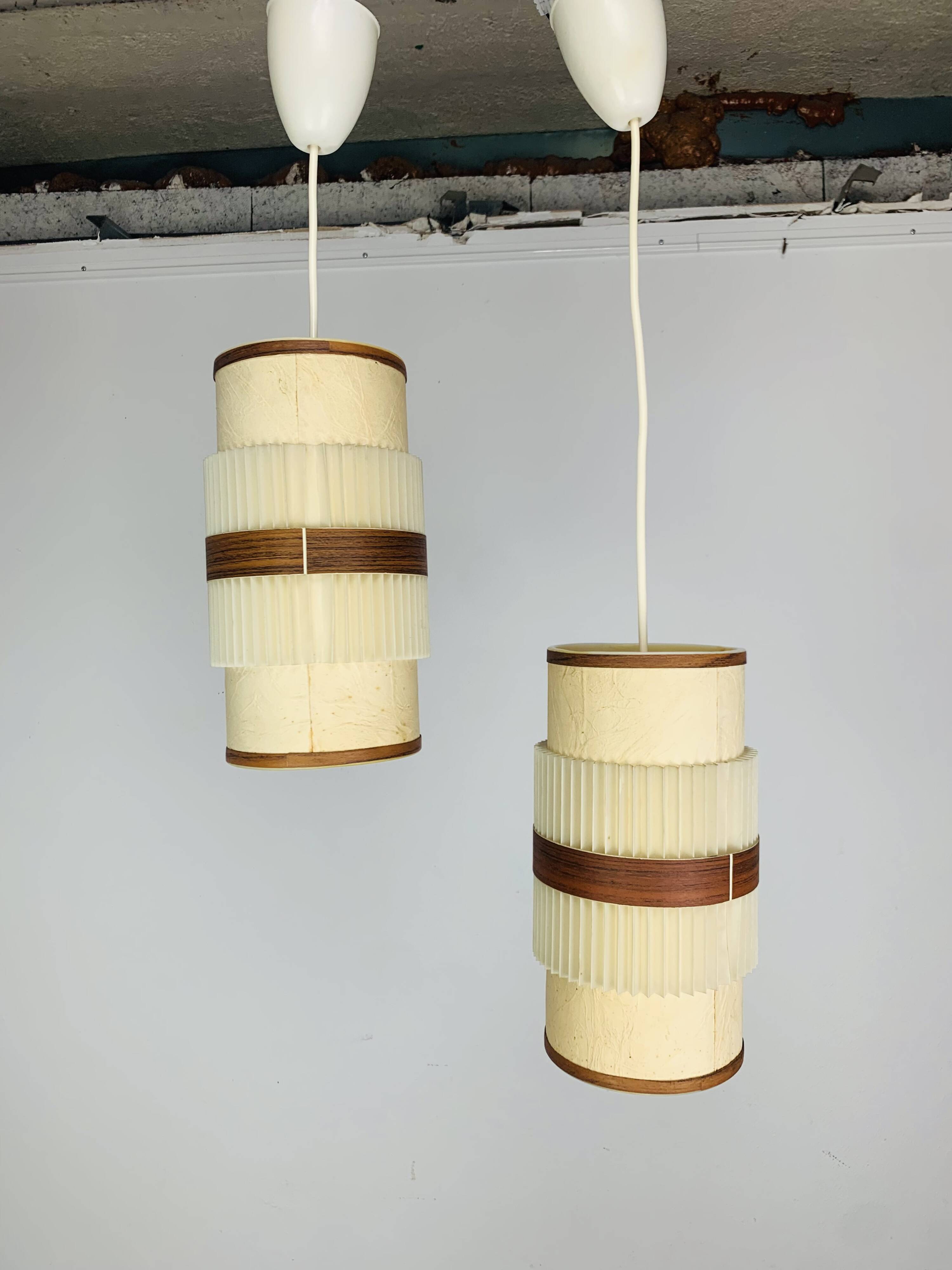 Pair of roller suspensions from the 70s, paper