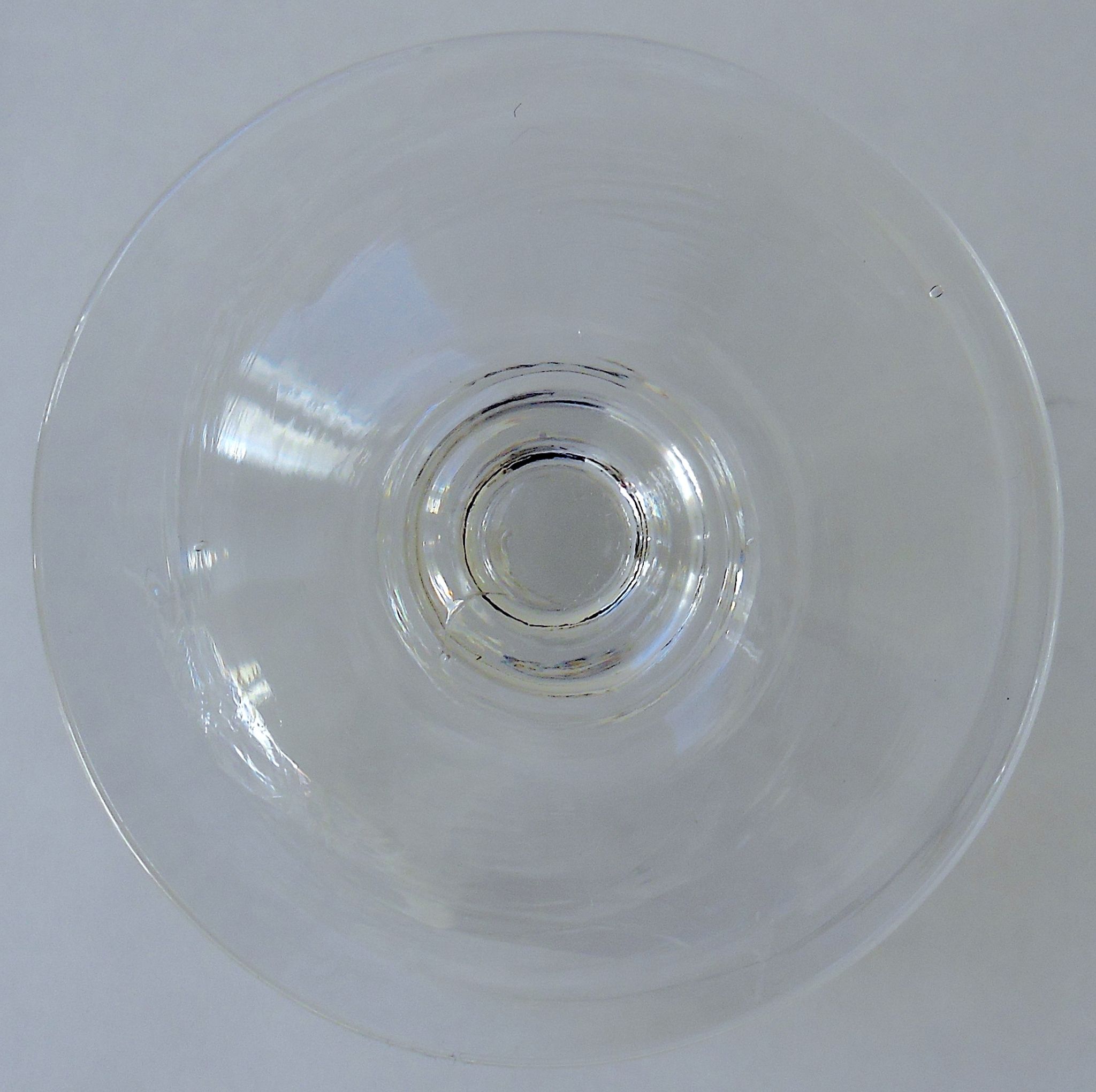 Suite of six champagne glasses on foot in engraved colorless crystal