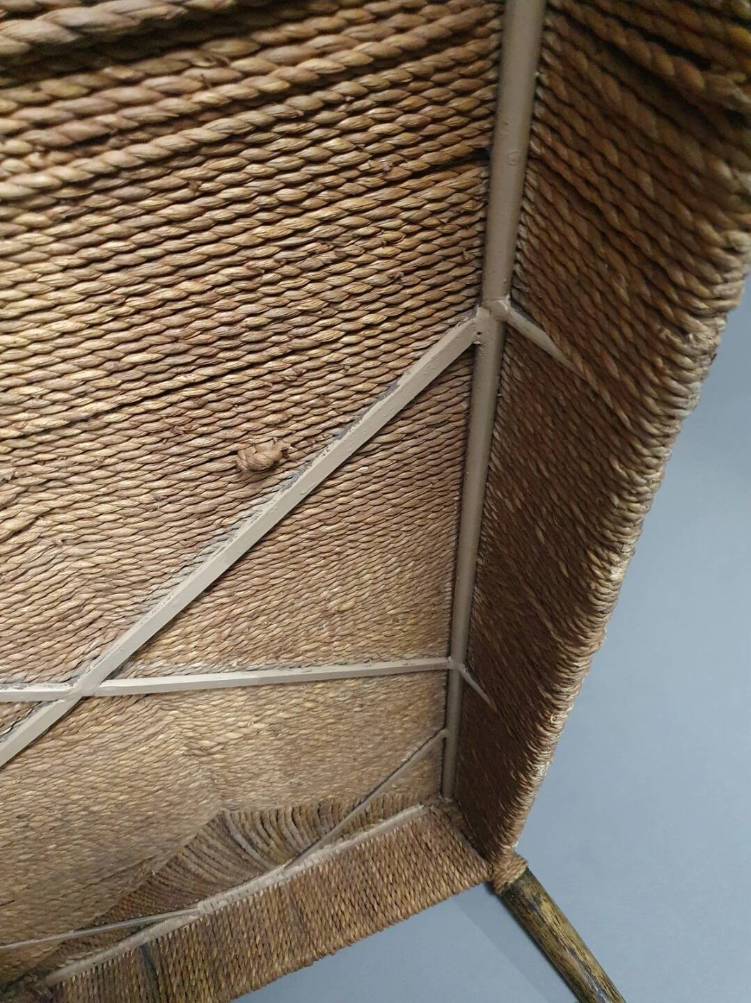 Vintage French papercord sofa with a metal frame base