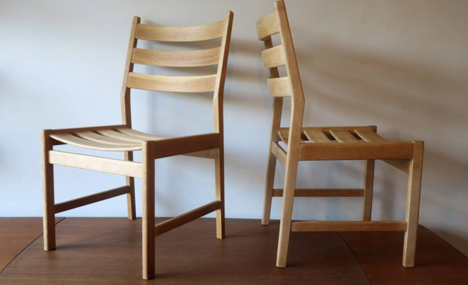 Pair of solid ash wide-seat dining chairs by Kurt Ostervig for KP Mobler, Denmark 1950s