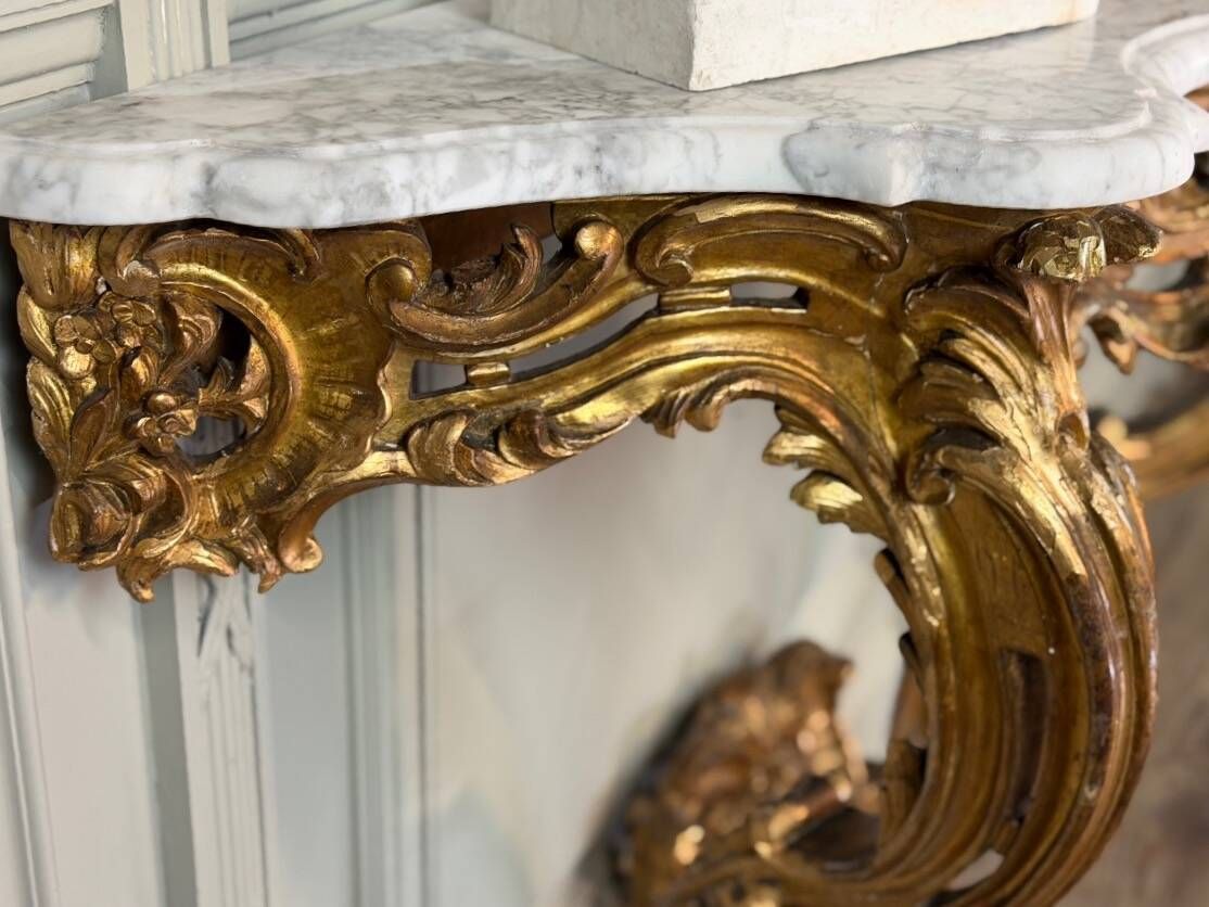 Louis XV style console in carved and gilded wood, circa 1880.