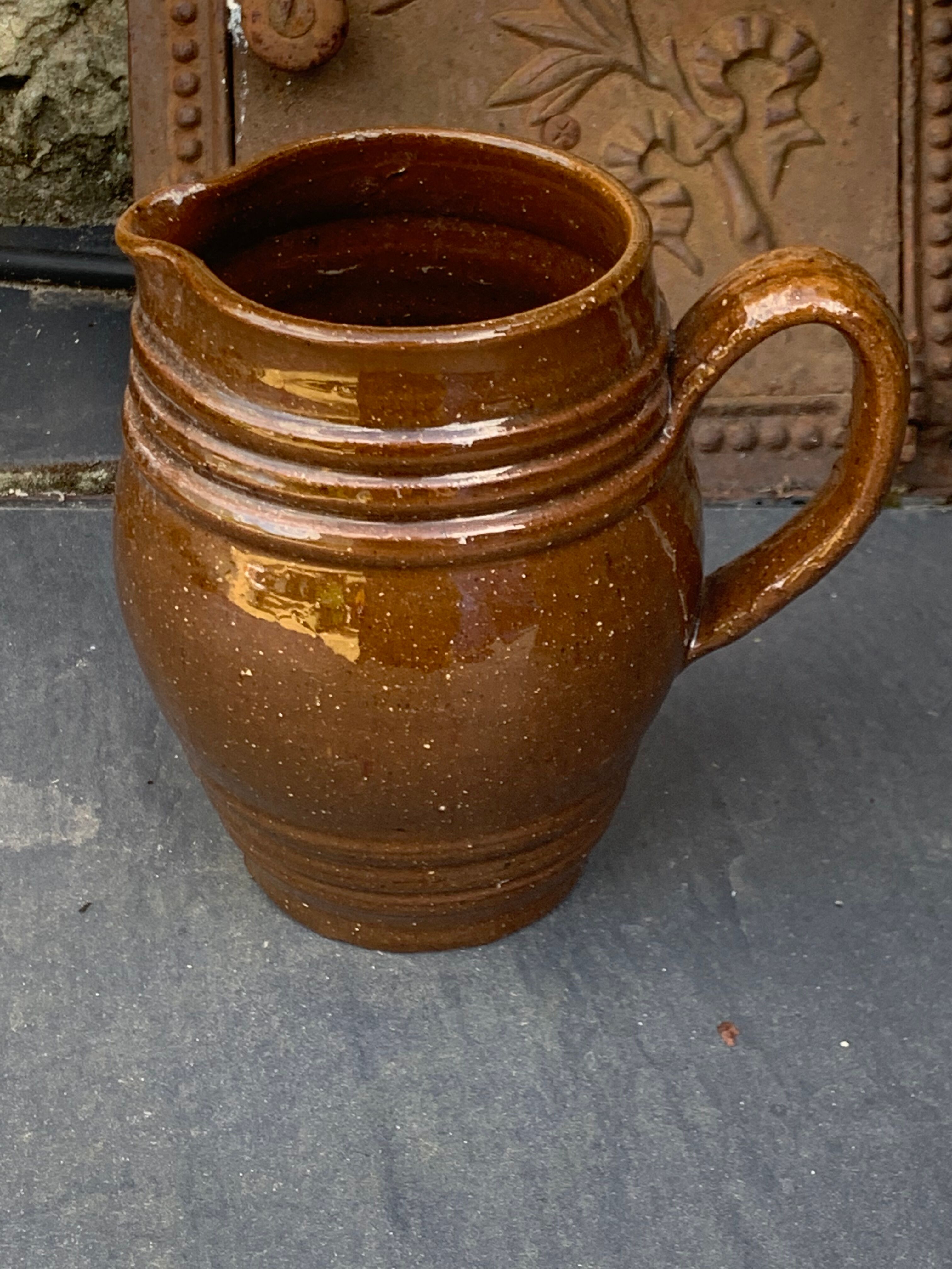Pitcher old cider jug in glazed sandstone