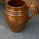 Pitcher old cider jug in glazed sandstone