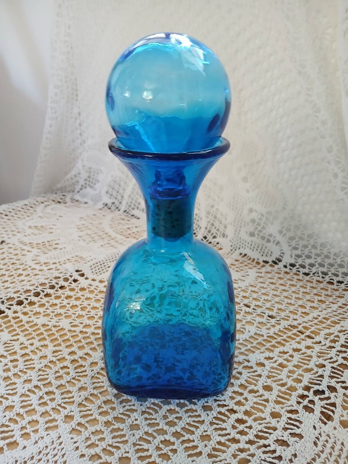 Blue embossed glass carafe