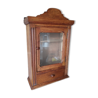 Old glass wall shelf with drawer door